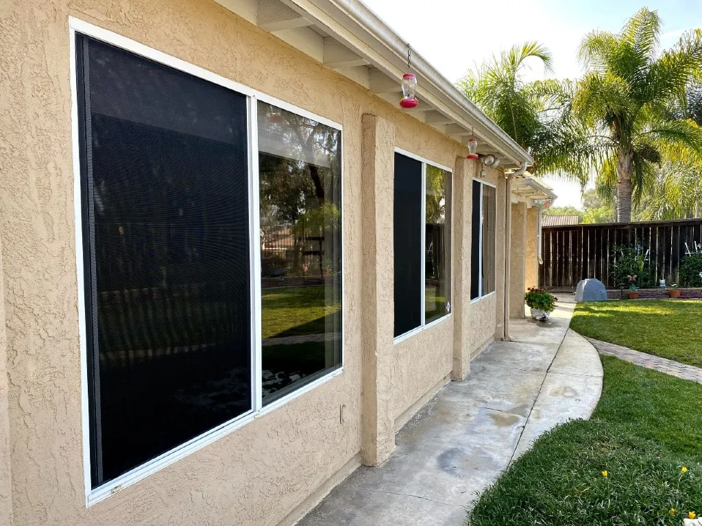 Custom window screen being built on-site