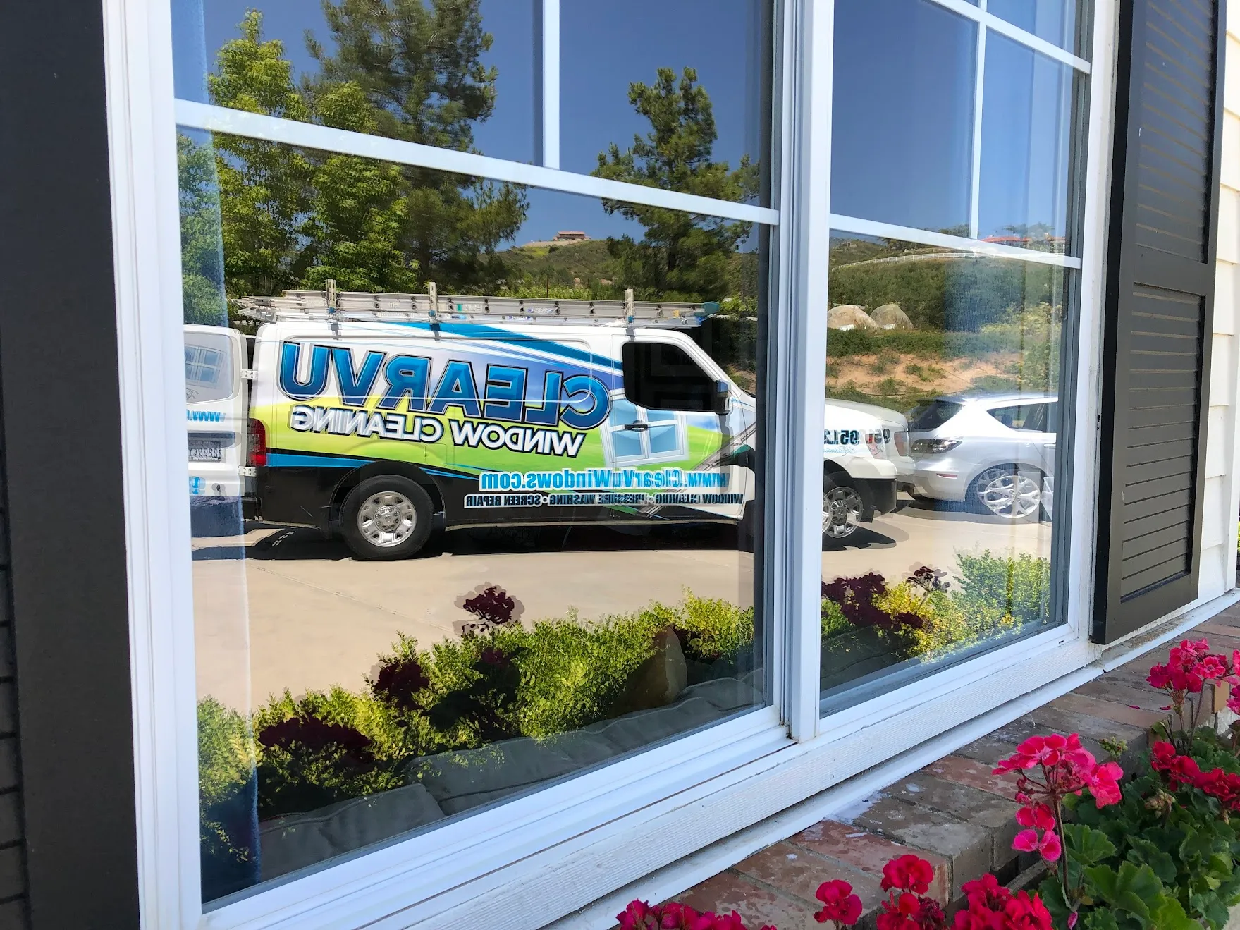 Clearvu Window Cleaning van reflected in freshly cleaned home windows in Temecula Valley