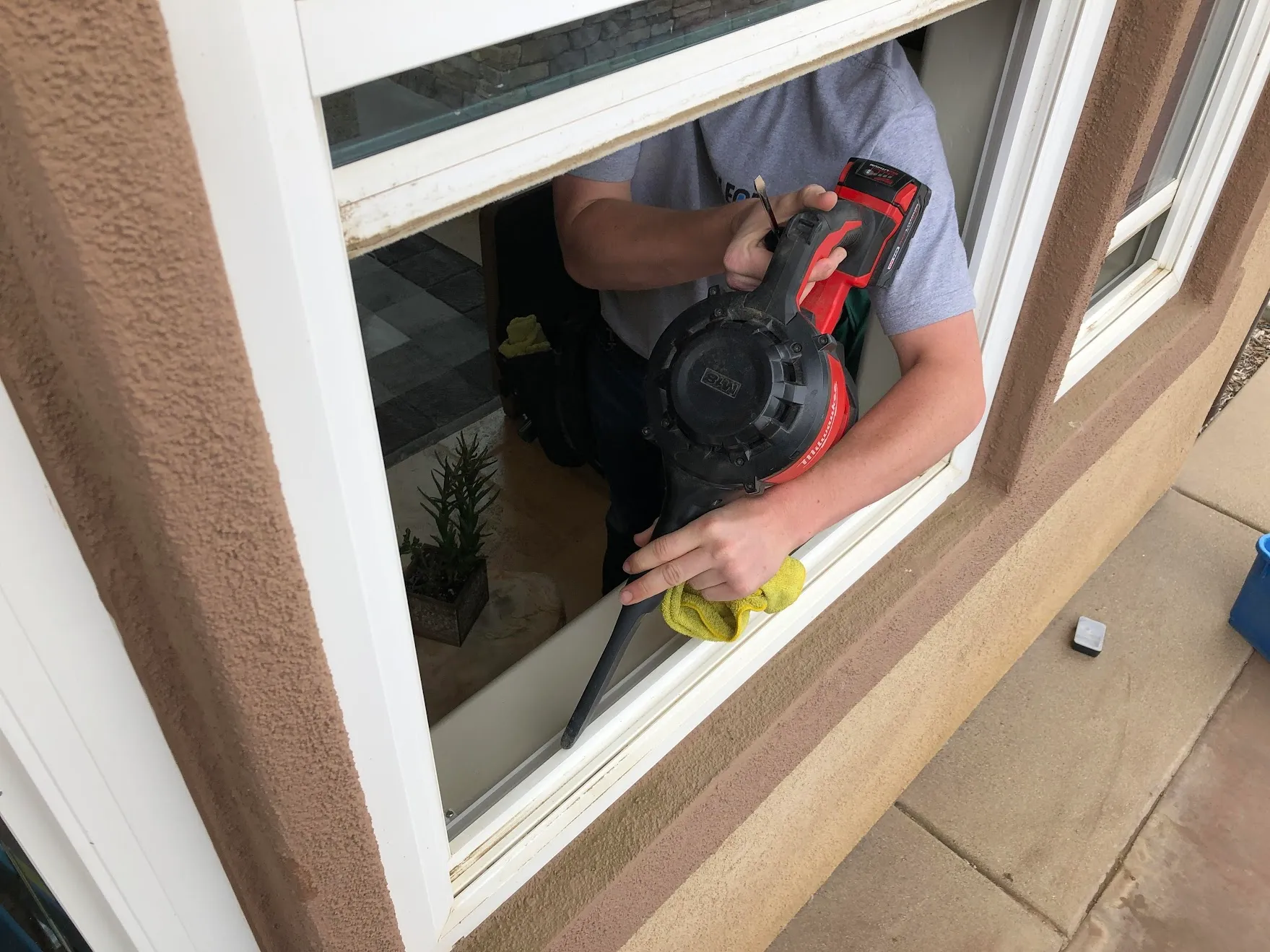 Detailed window track cleaning removing dirt and debris from sliding door tracks